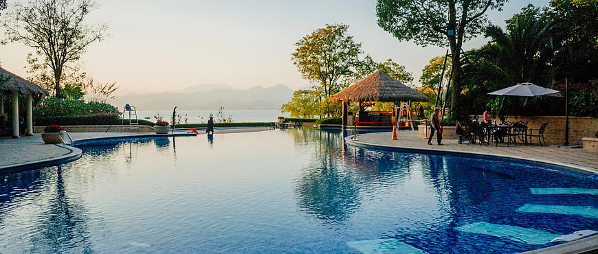 Luxury Resort Infinity Pool with Lake and Mountain View
