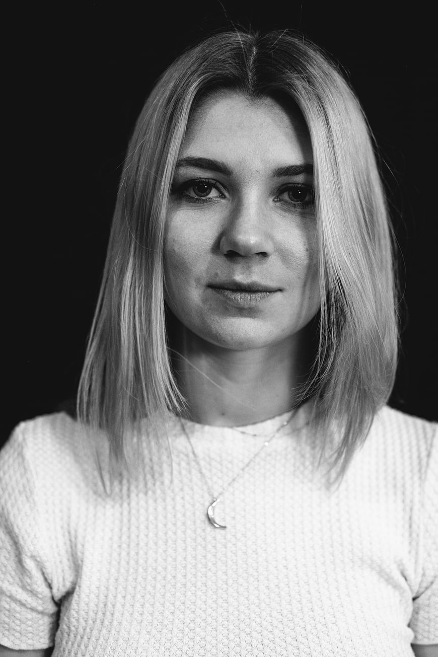 Black and white portrait of a young woman with blonde hair