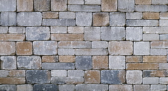 Textured Stone Wall Background with Gray and Brown Blocks