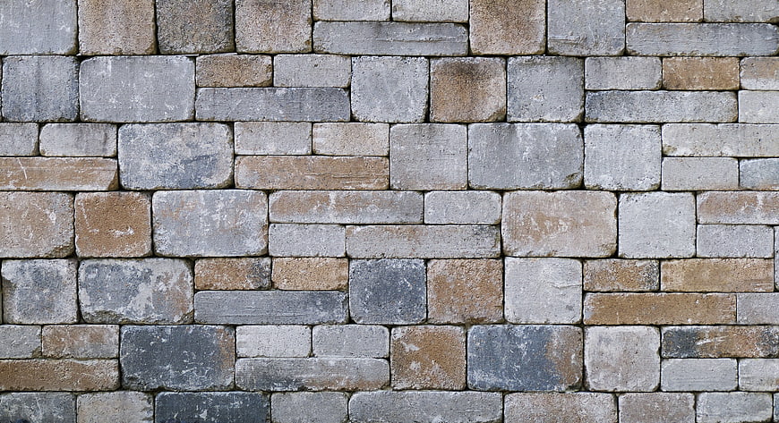 Textured Stone Wall Background with Gray and Brown Blocks