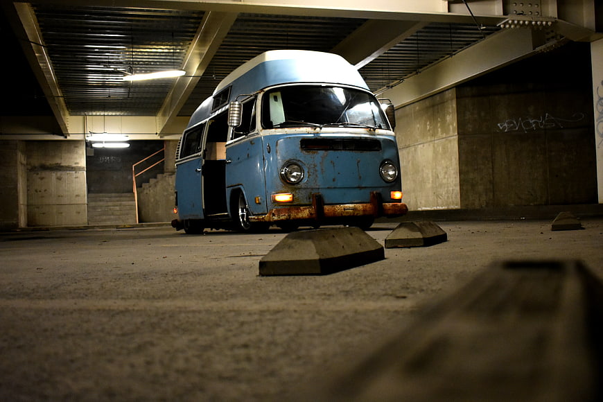 Vintage Blue VW Bus in Underground Parking Garage