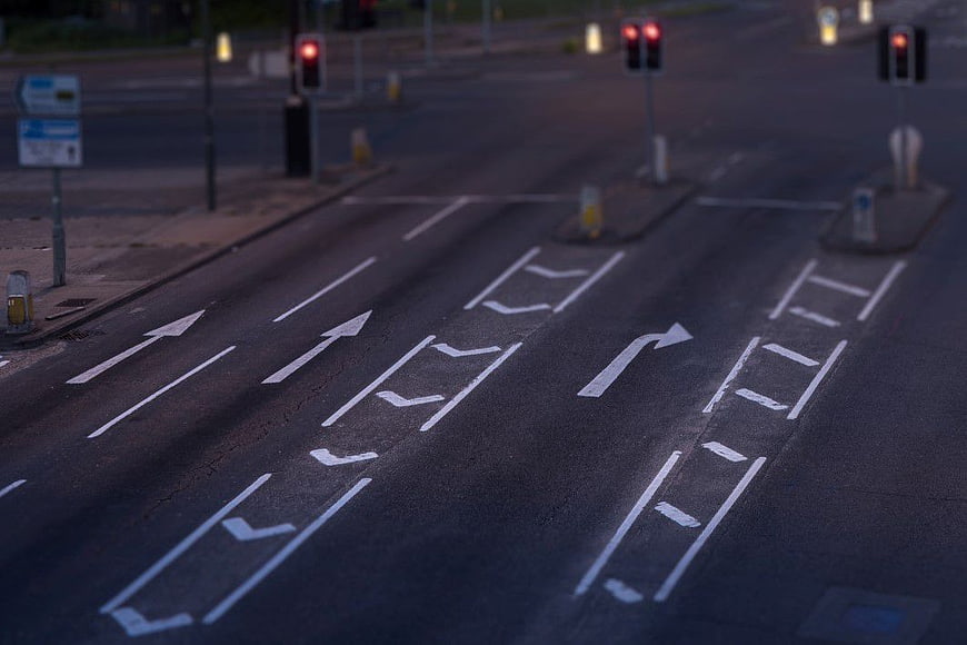Empty Road Junction with Lane Markings at Night