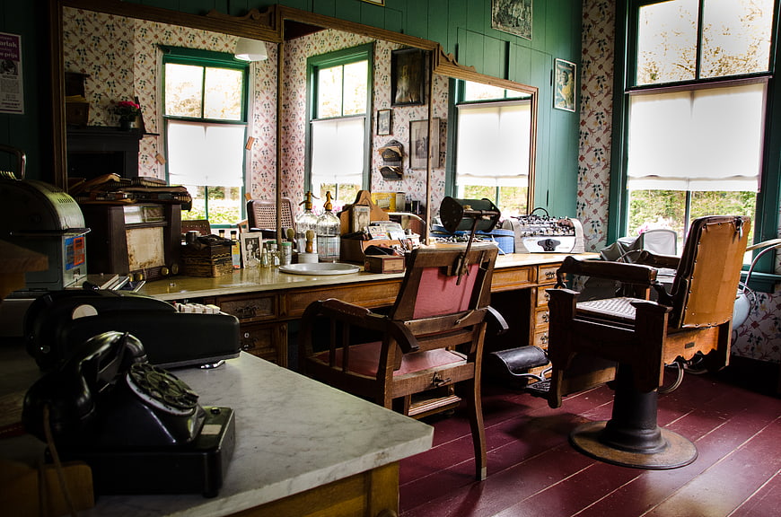 Vintage Barbershop Interior with Antique Chairs and Tools