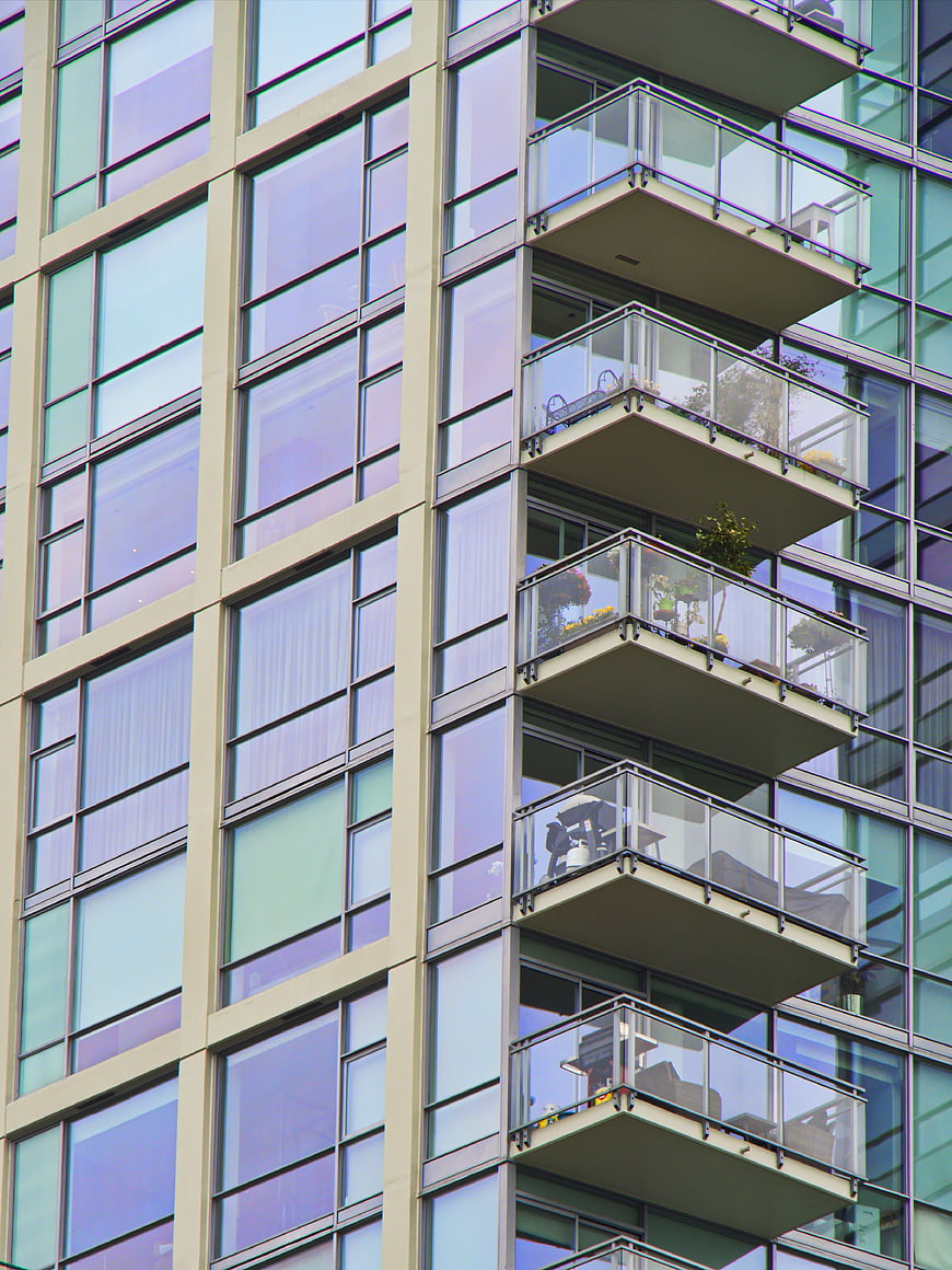 Modern Apartment Building Facade with Glass Balconies