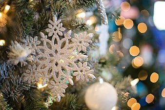 Close-up of Glittering Silver Snowflake Christmas Ornament