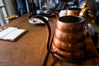Vintage Copper Gooseneck Kettle on Wooden Table