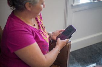 Senior Woman Using Smartphone Indoors