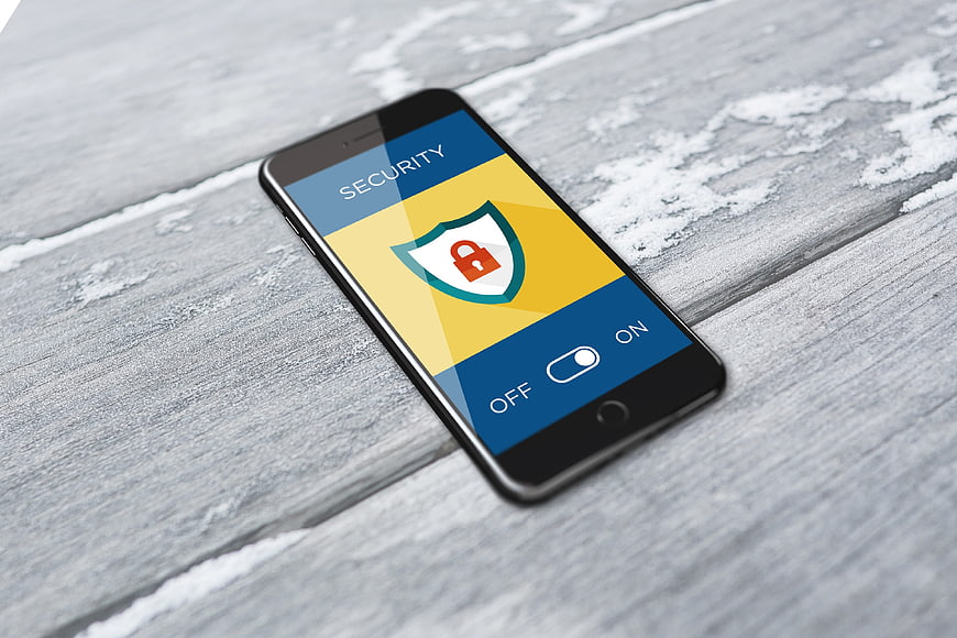 Smartphone displaying security app with shield and lock icon