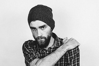 Black and white portrait of bearded man in beanie