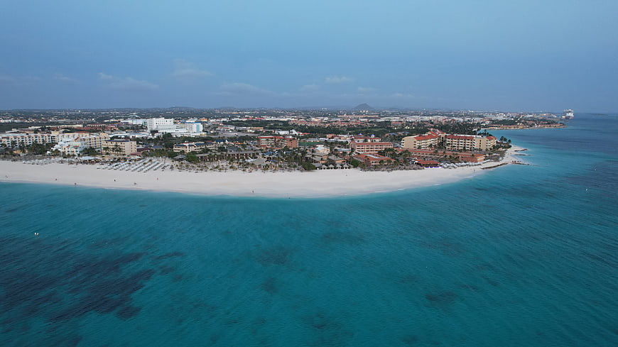 Aerial View of Tropical Beach Resort and Turquoise Ocean