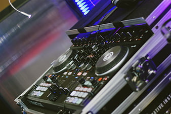 Professional DJ Controller Setup with Blue and Purple Lighting