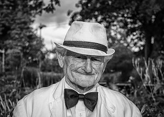 Senior man in fedora hat and bow tie portrait
