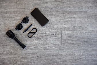 Black EDC Gear Flat Lay on Gray Wood Background