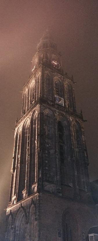 Martinitoren Groningen illuminated in fog at night