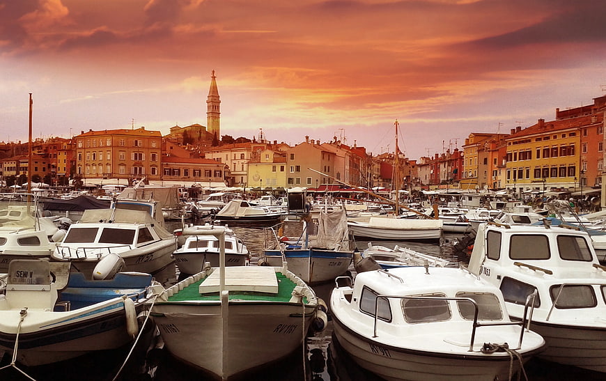 Boats in Harbor at Sunset with Church Tower