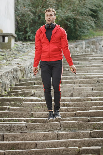Athletic Man Jumping Rope on Stone Steps