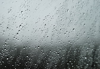 Raindrops on a Window Pane with Blurred Background