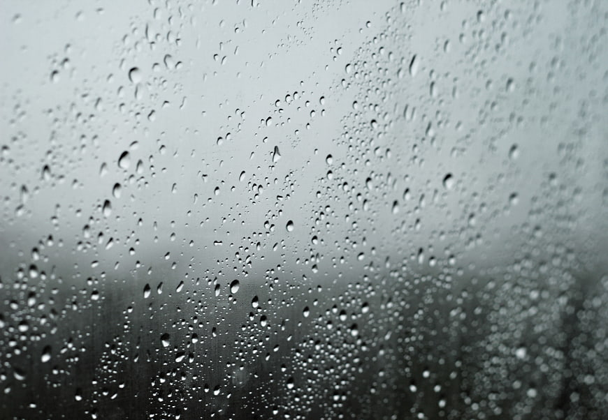Raindrops on a Window Pane with Blurred Background