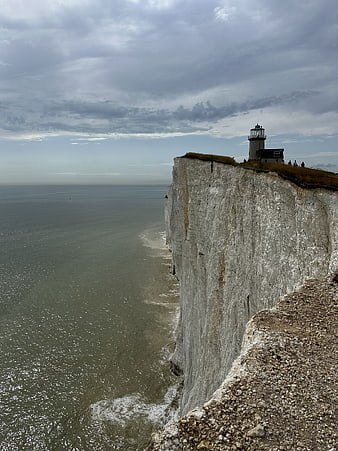 Lighthouse on White Cliffs Overlooking the Sea