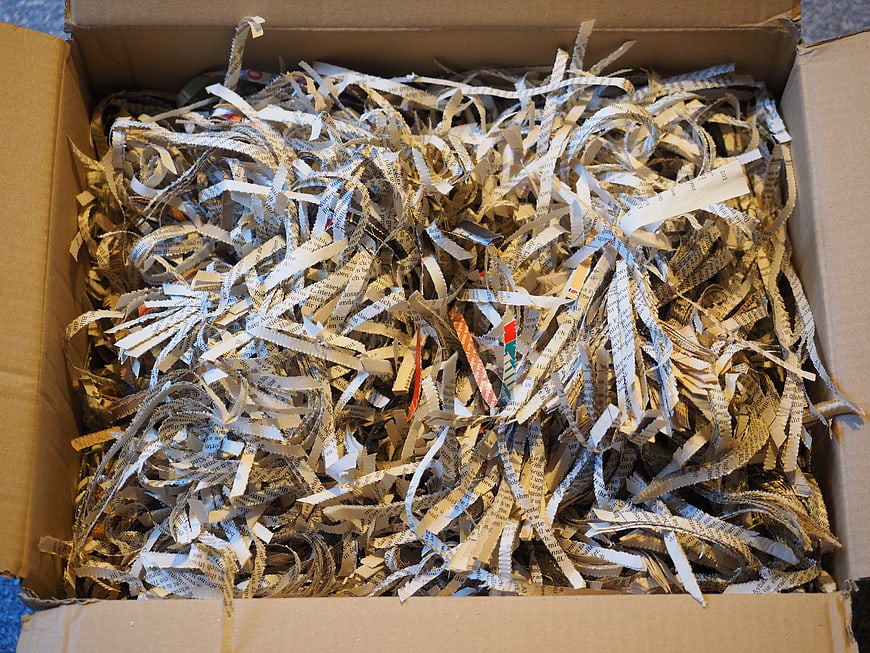 Box of Shredded Paper Strips for Recycling and Waste Disposal
