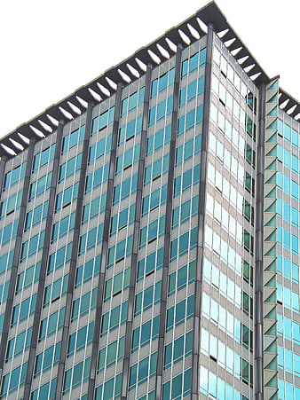 Low angle view of modern glass office building facade