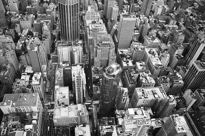 Aerial black and white view of dense city skyscrapers