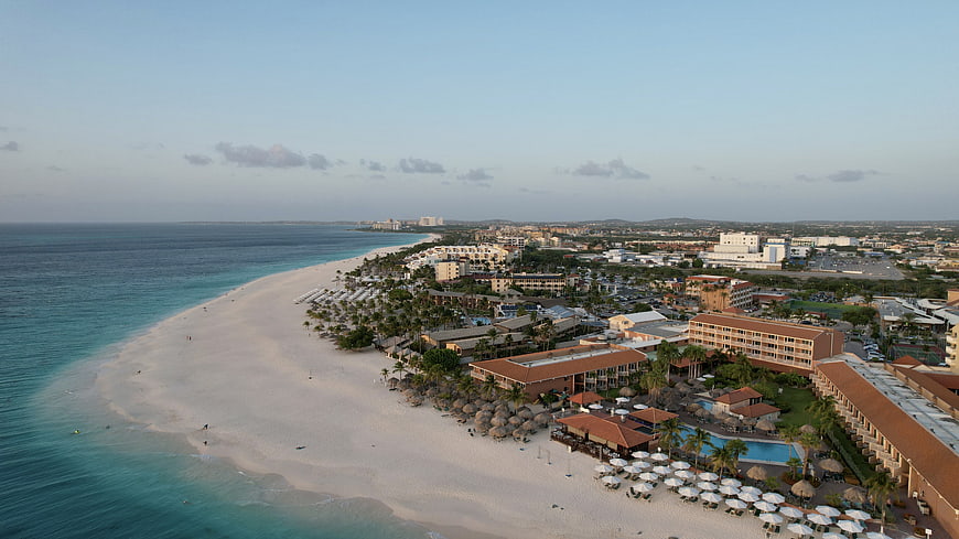 Aerial View of Tropical Beach Resort and Turquoise Coastline