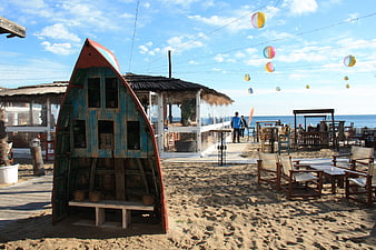 Beach Cafe with Decorative Boat and Ocean View