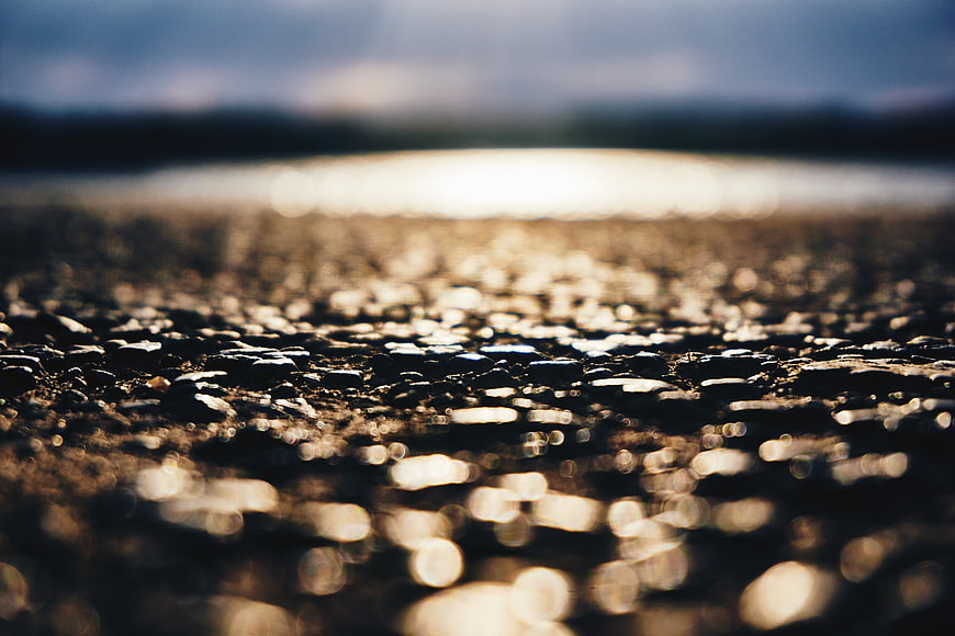 Abstract Shallow Depth of Field Pebble Beach at Sunset