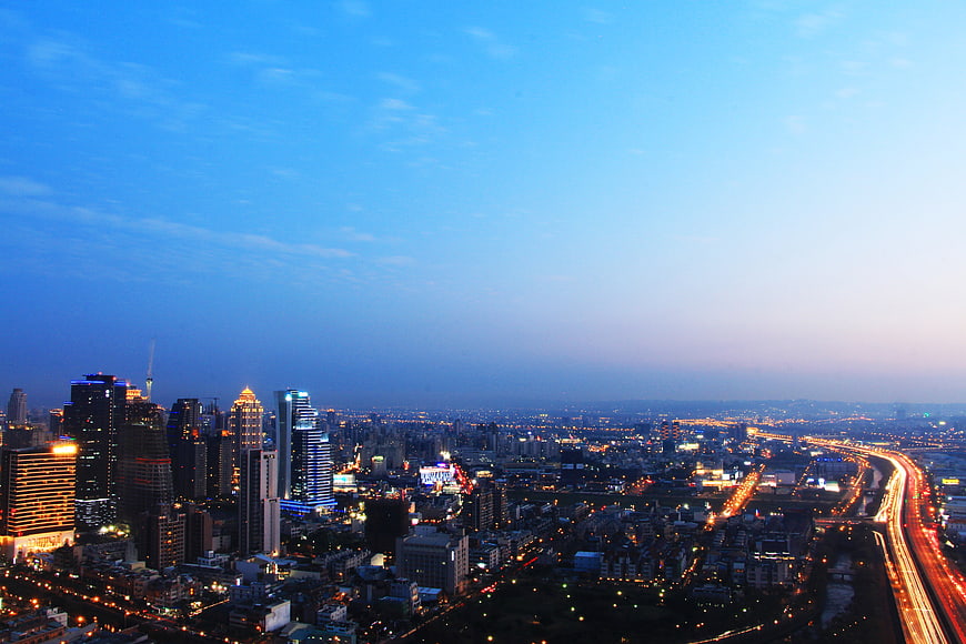 Aerial View of Taichung City Skyline at Dusk with Highway Traffic