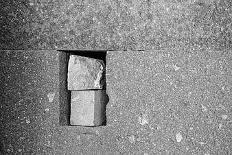 Black and white texture of stone blocks in a wall gap