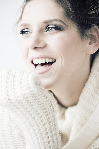 Close-up Portrait of Happy Woman Laughing in Knit Sweater