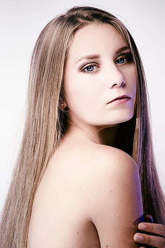 Studio Portrait of Young Woman With Long Blonde Hair