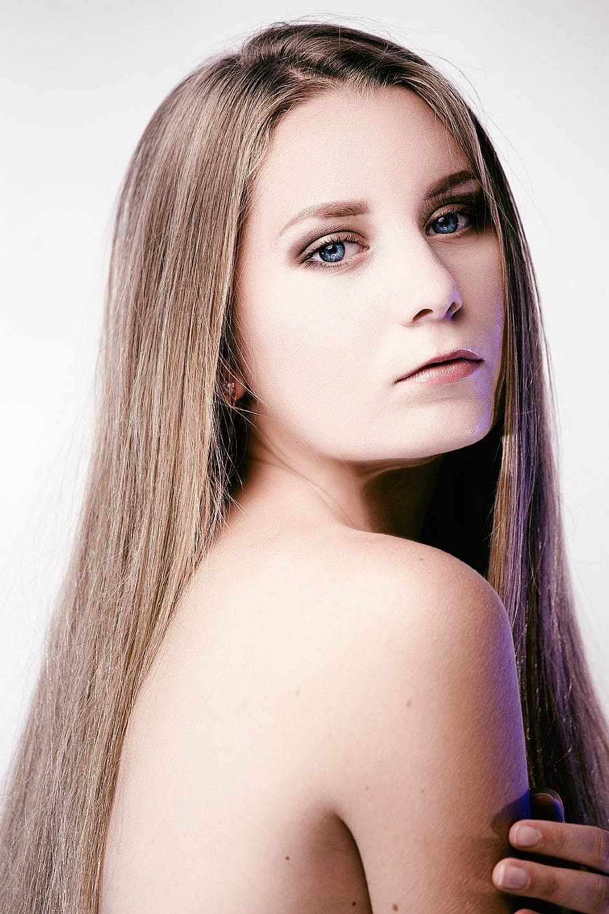 Studio Portrait of Young Woman With Long Blonde Hair