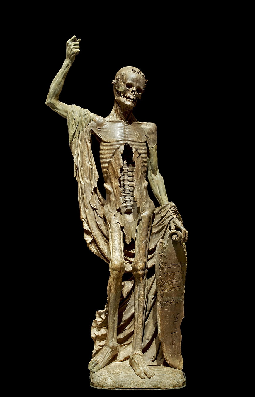 Gothic Skeleton Sculpture with Torn Robes and Tombstone