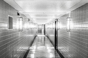 Black and white tiled hallway with vintage lights