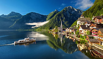 Hallstatt Village and Lake with Mountains and Boat in Austria