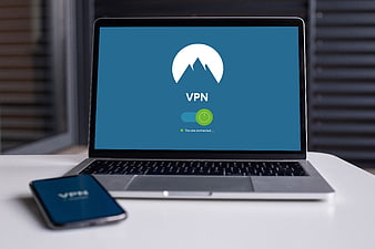 Laptop and smartphone displaying VPN connection interface