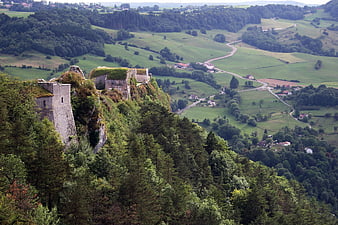 Medieval Fortress Ruins Overlooking Green Rolling Hills