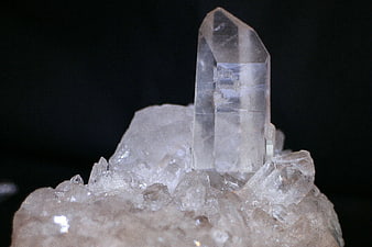 Clear Quartz Crystal Point on Raw Rock Base