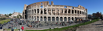 Panoramic View of the Colosseum in Rome with Tourists