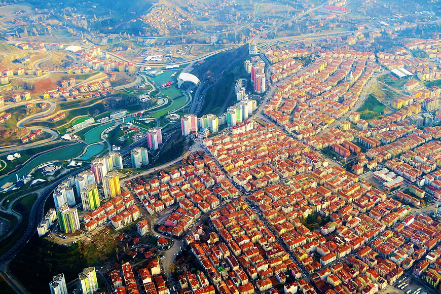 Aerial View of Urban Cityscape with Residential Blocks and River