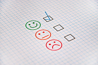 Customer Satisfaction Survey Form With Smiley Faces On Grid Paper