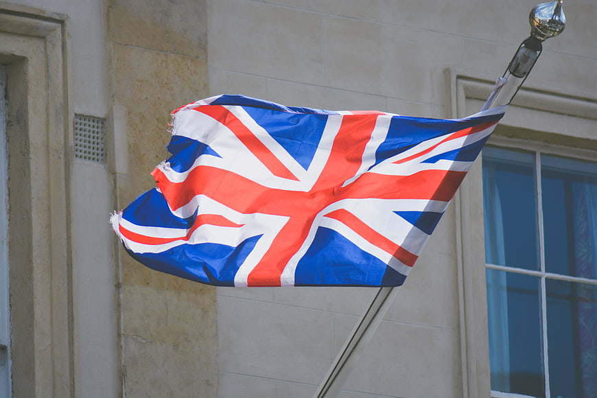 Union Jack Flag Waving on Building Exterior