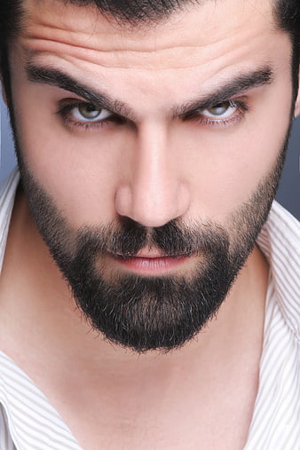 Intense Close-Up Portrait of Handsome Bearded Man
