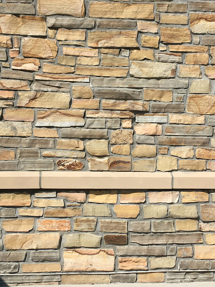 Textured Stone Wall with Horizontal Beige Band