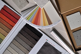 Interior design materials, fabric swatches, and color palette samples