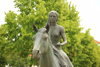 Bronze Statue of Woman Riding Horse in Park
