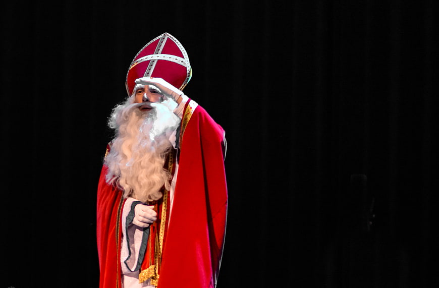 Sinterklaas in Red Robes Saluting on Stage