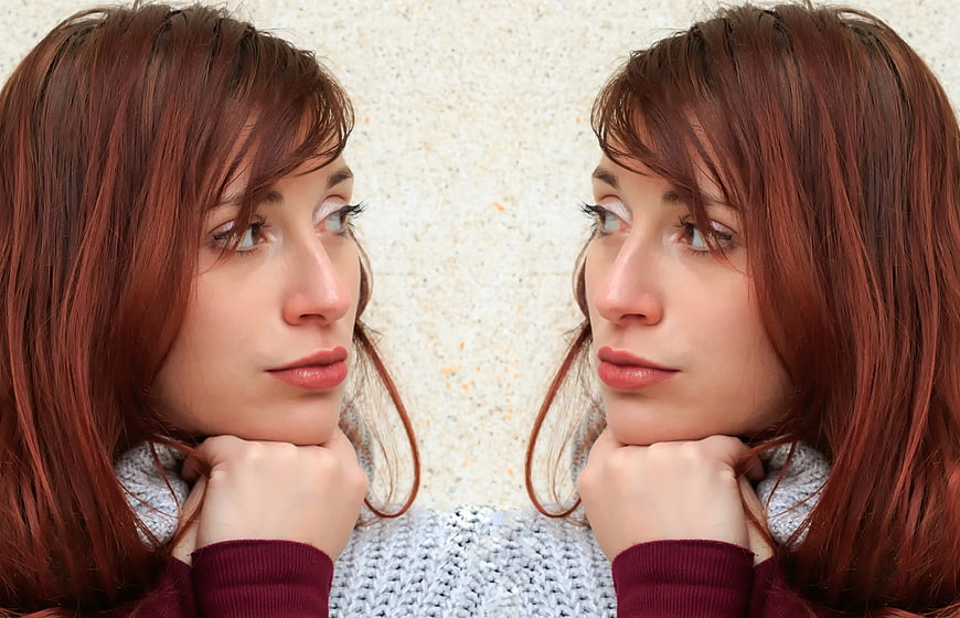 Symmetrical Portrait of Woman with Red Hair Looking Sideways